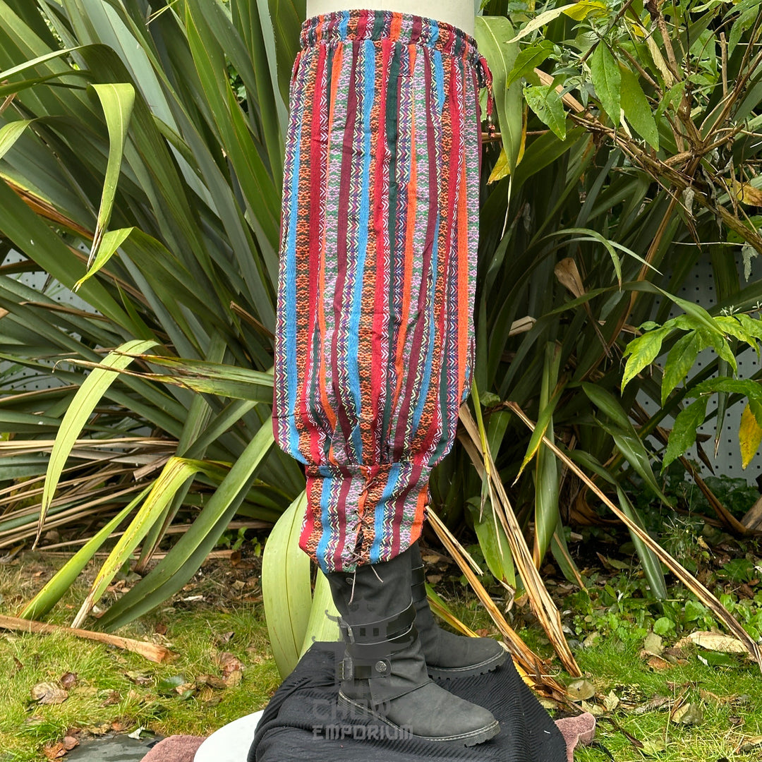 Side view of multi-color cotton LARP trousers with calf lacing and braid detail.