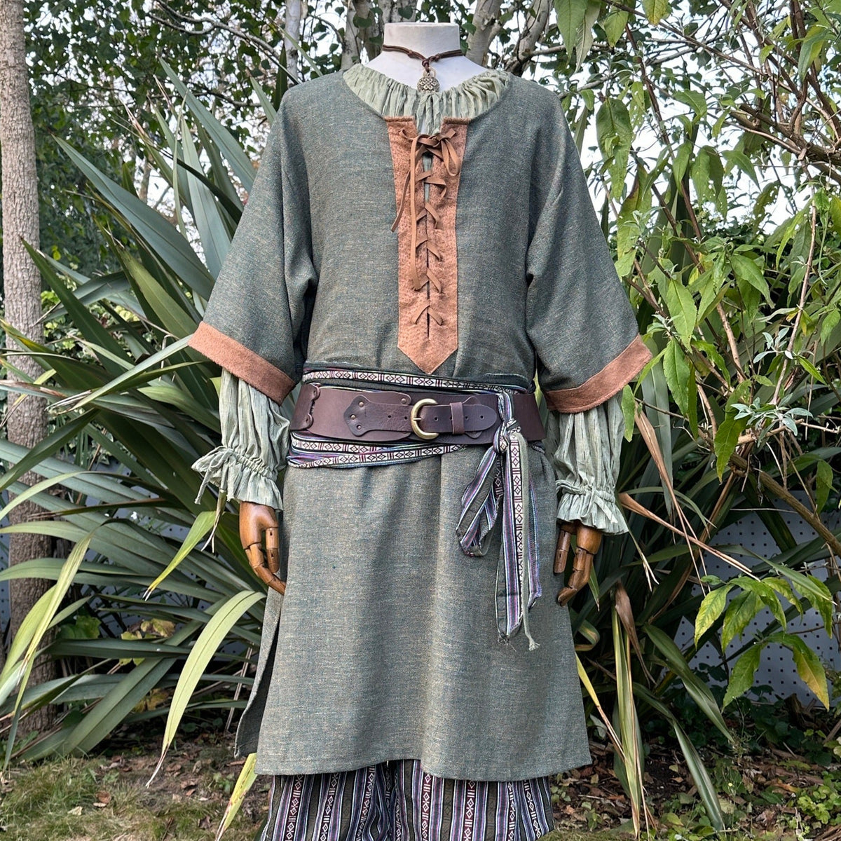 Green and brown woven medieval tunic for LARP with decorative belt.