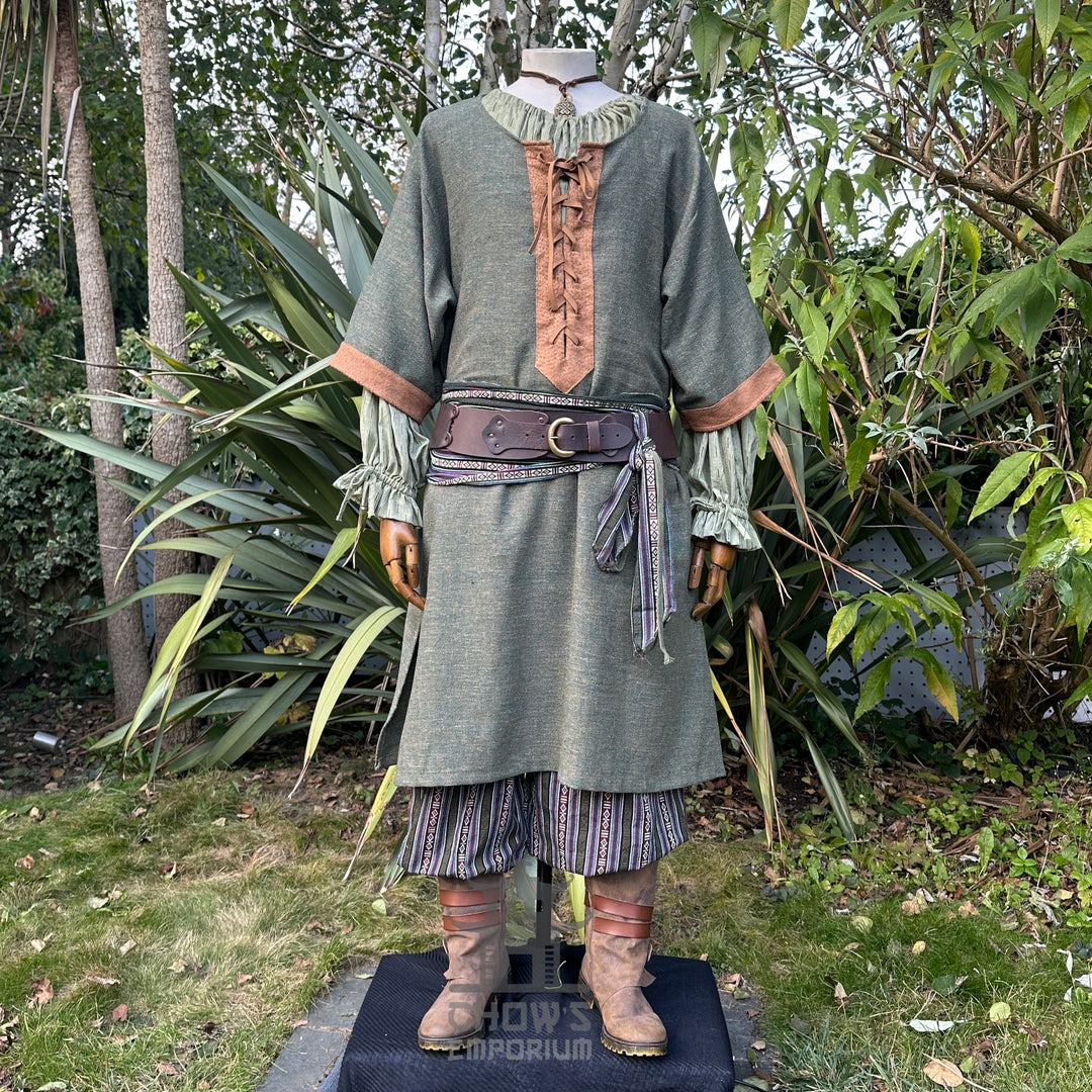 LARP outfit with lace-front tunic, wide belt, and striped pants.