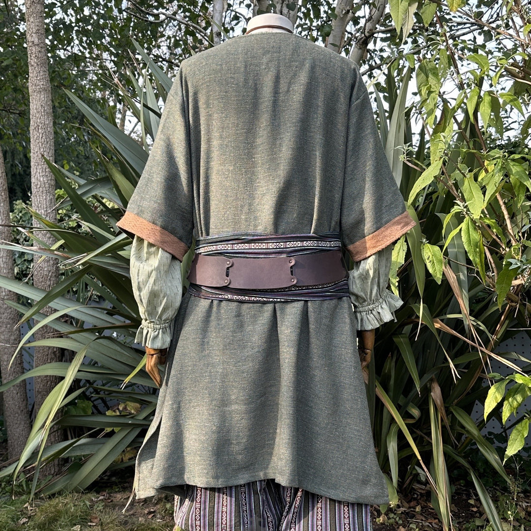 Green medieval LARP tunic, back view, with brown sash and detailed sleeves.