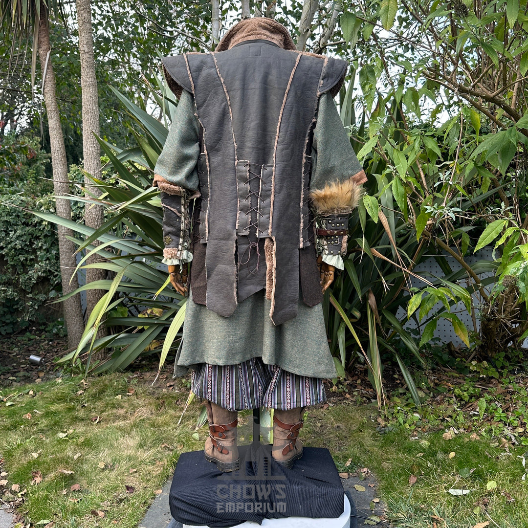 Back view of green medieval LARP waistcoat with leather lace-up details.