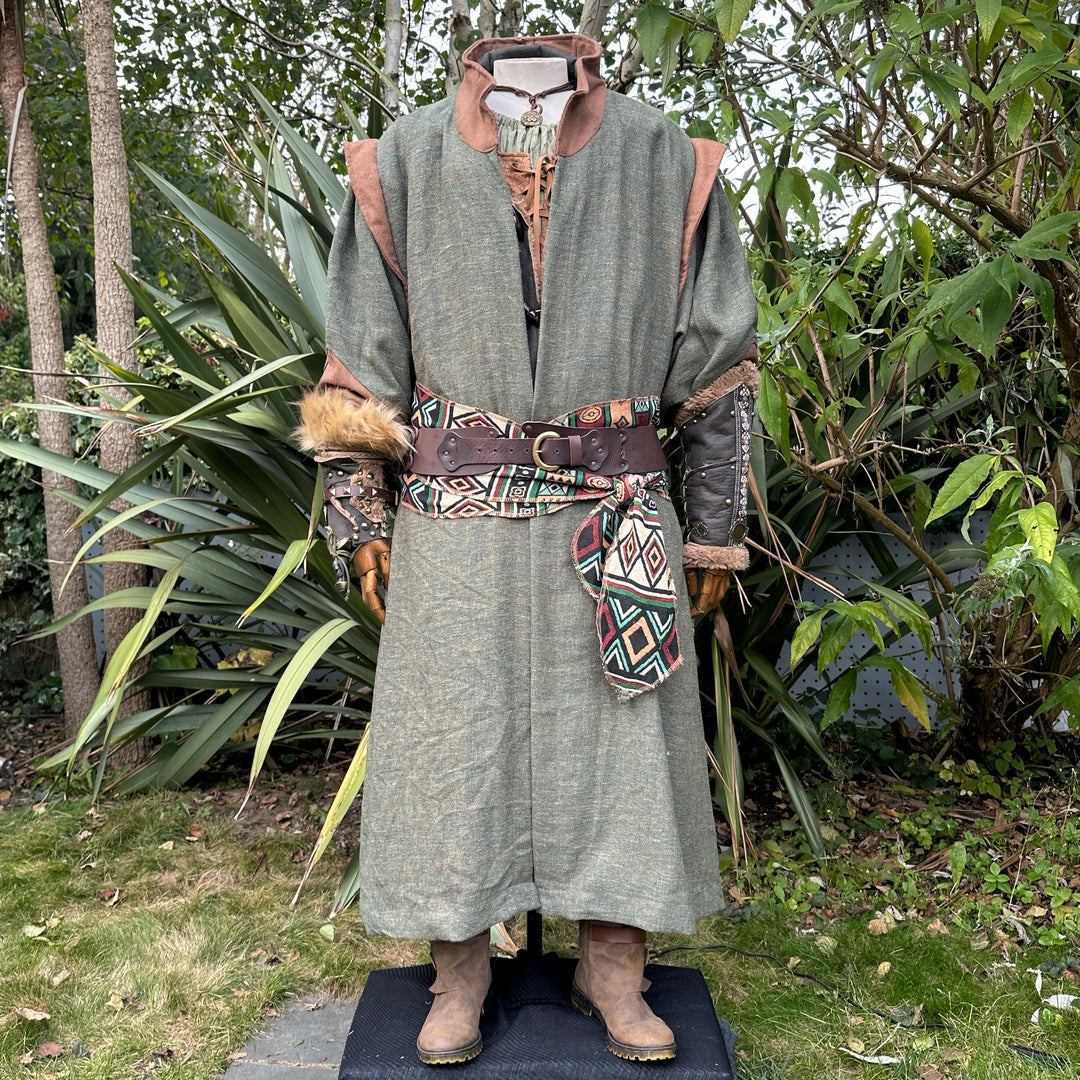 LARP forest guardian outfit with green robe, patterned belt, leather accents.