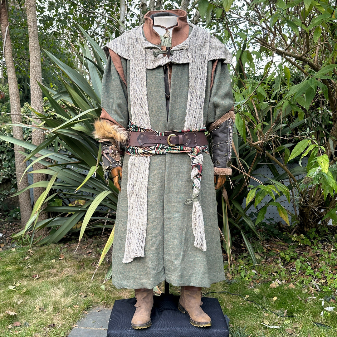 Medieval LARP costume front view featuring green robe, wool hood, vambraces, belt, sash and.