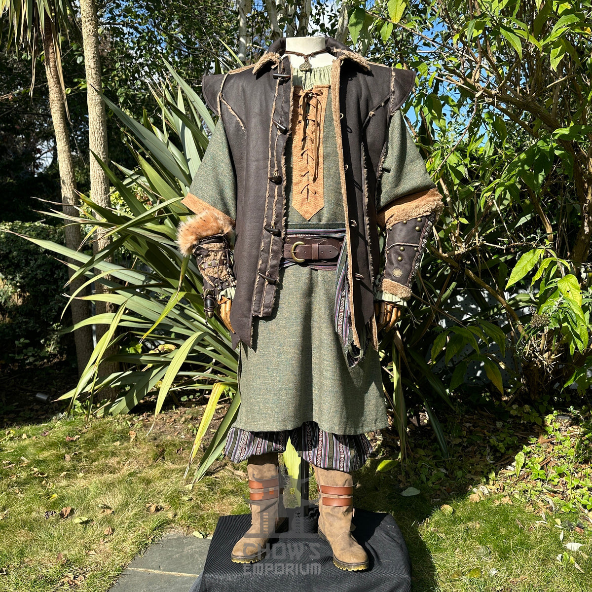 Forest Wanderer LARP outfit with green robe, brown waistcoat, and vambraces.