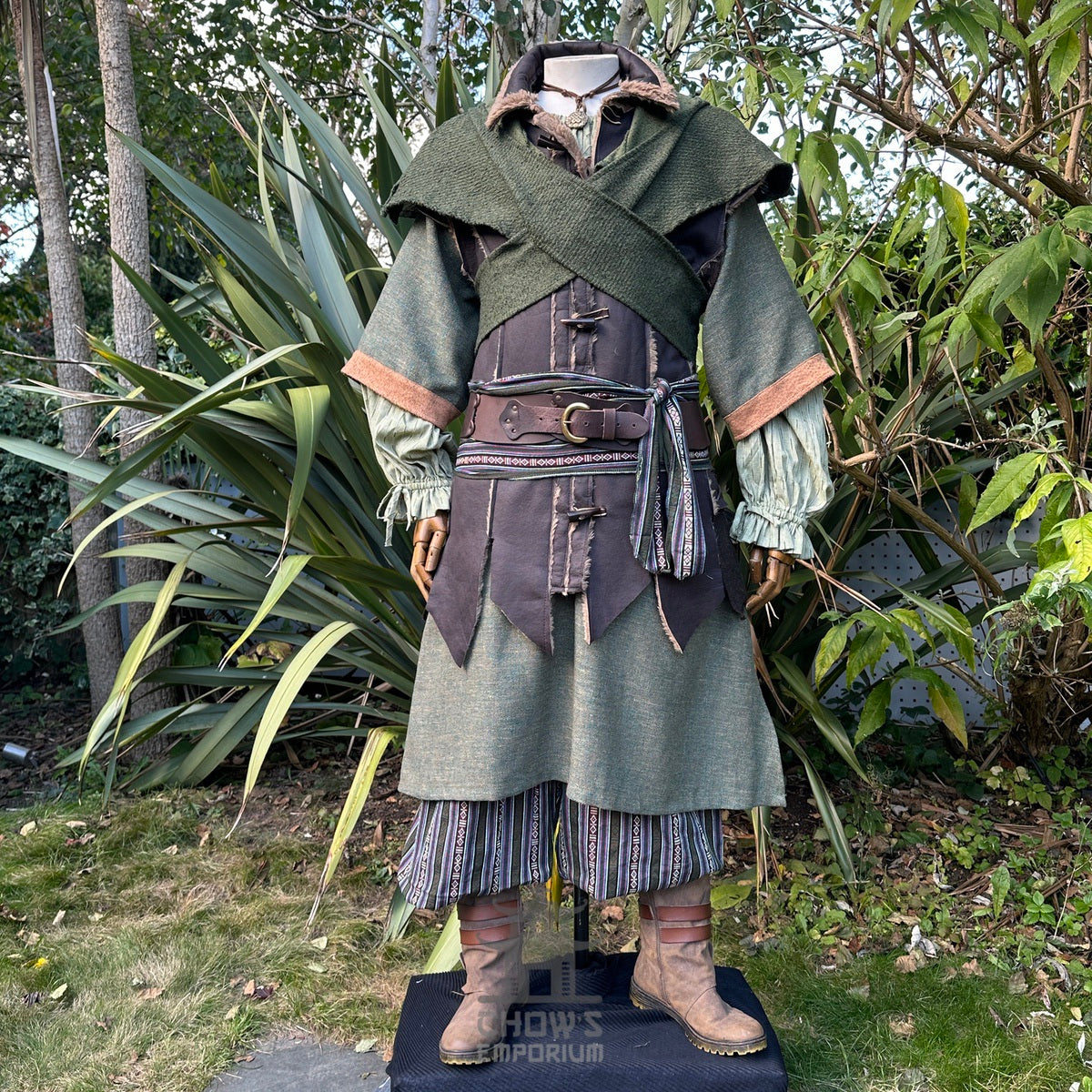 Medieval LARP costume with brown boots, striped trousers.