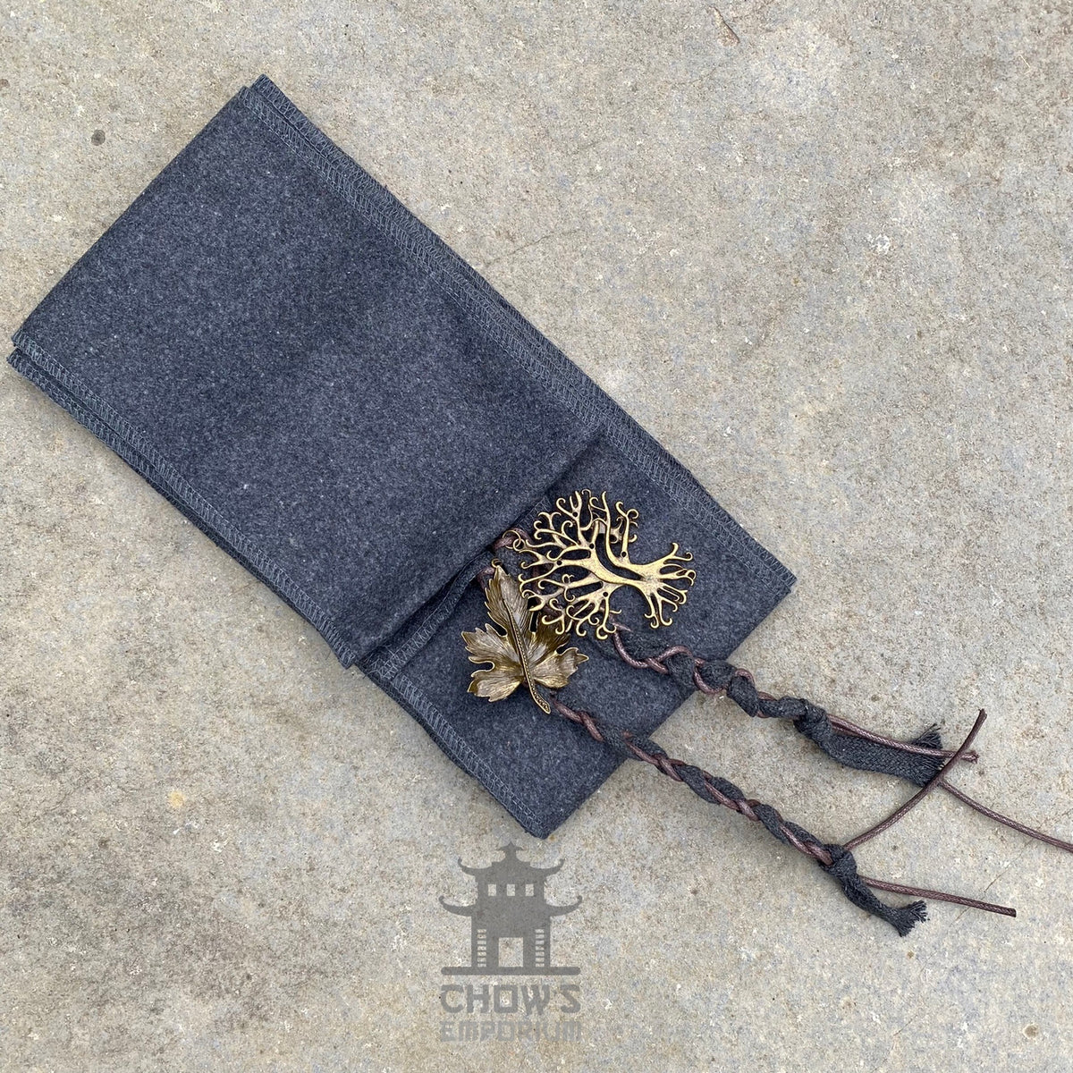 Braided leather straps with gold leaf and tree charms, LARP medieval style.