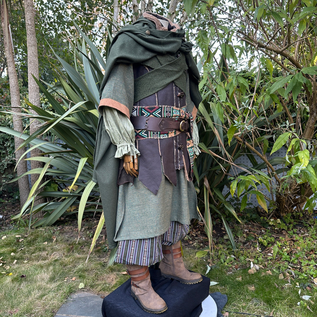 Side view of green medieval cloak and robe outfit for LARP.