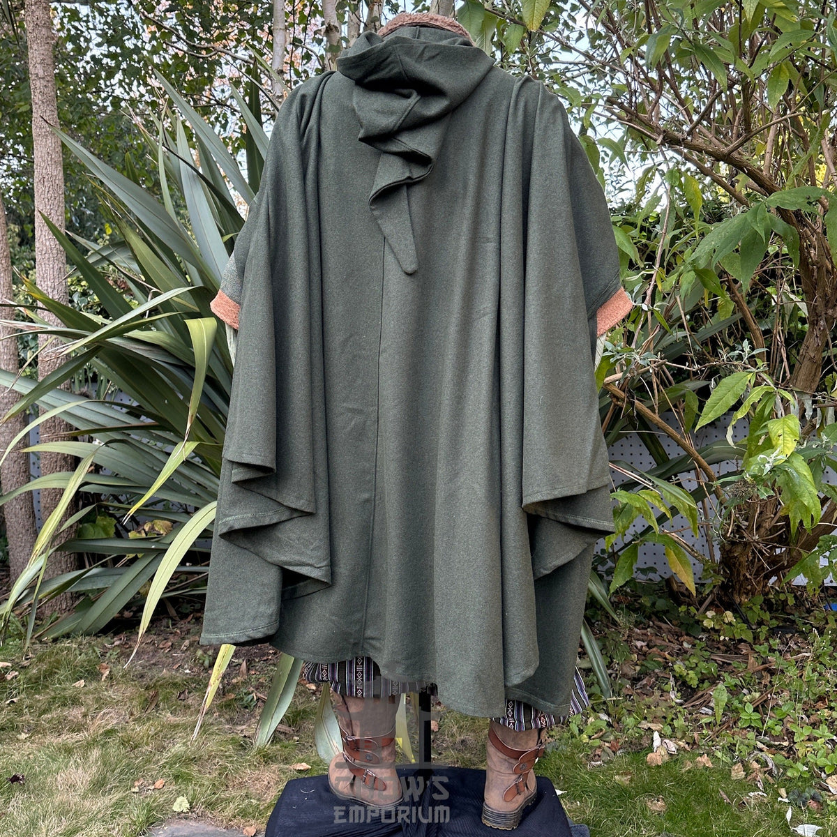 Medieval LARP outfit back view, featuring a green cloak, waistcoat, hood, shirt, trousers, belt.