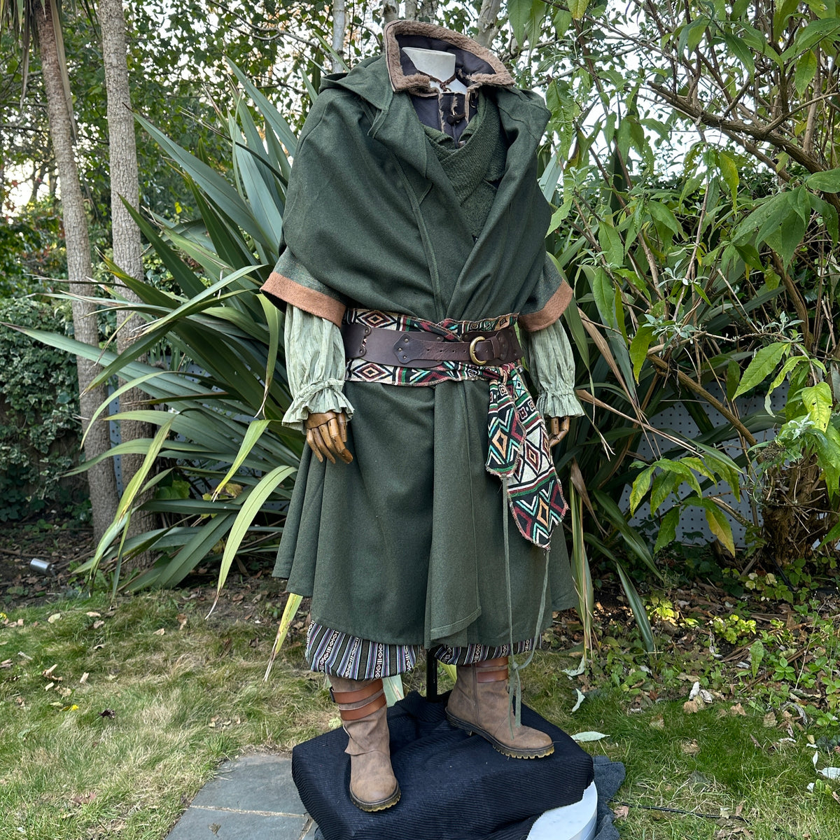 Green medieval LARP robe with hood, intricate belt, side.