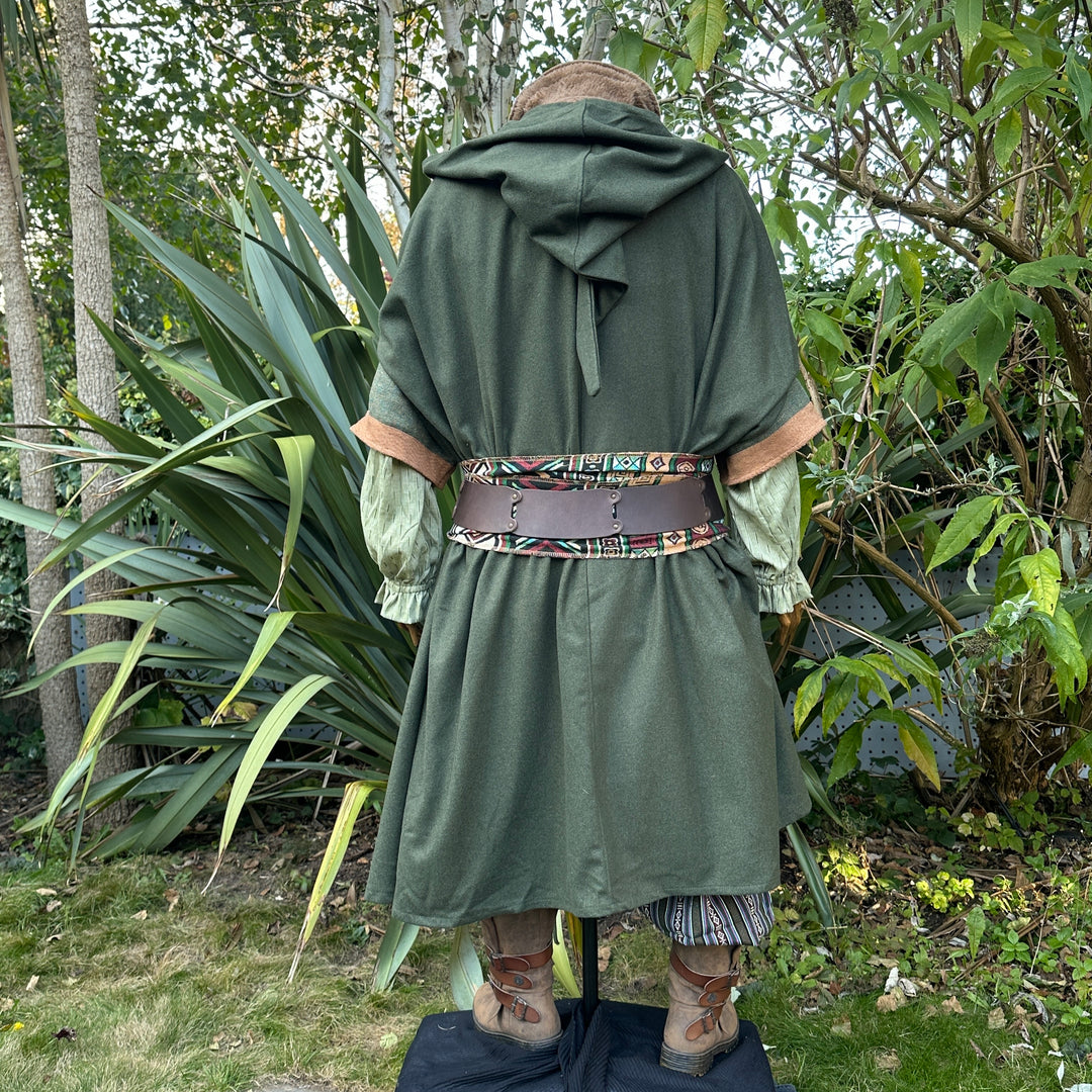 Back view of green wool cloak with hood, medieval LARP style, nature setting.