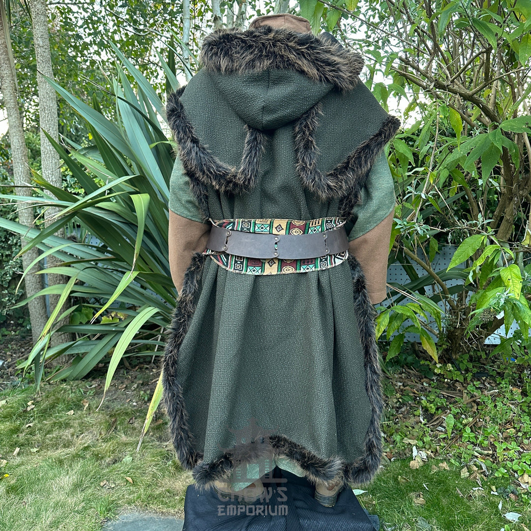 LARP costume back view, green hooded cape with fur trim, colourful belt visible.