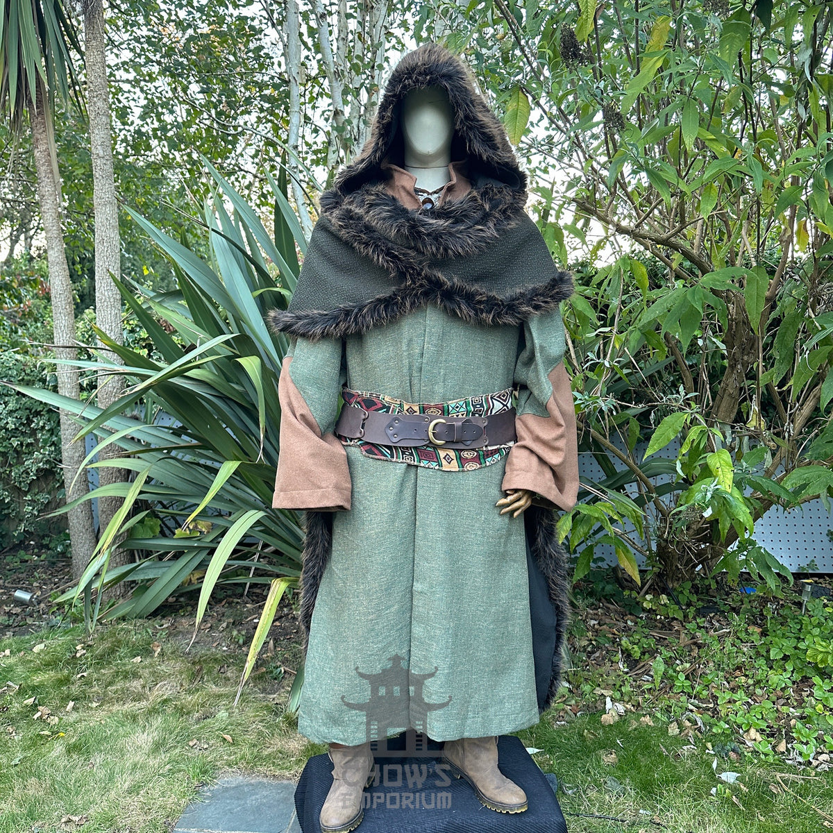 Medieval LARP costume with fur-lined hood and colourful patterned belt.