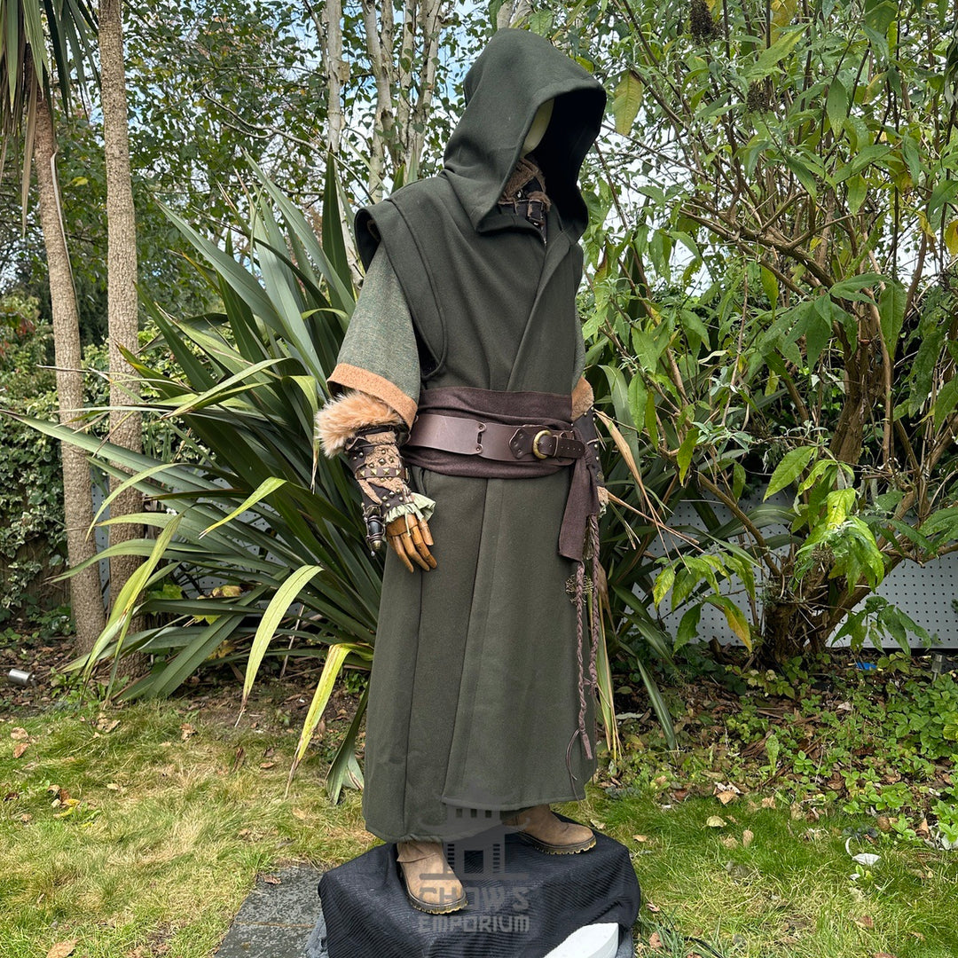 Medieval LARP outfit side view, featuring a green hooded robe, vambraces, belt, and sash.