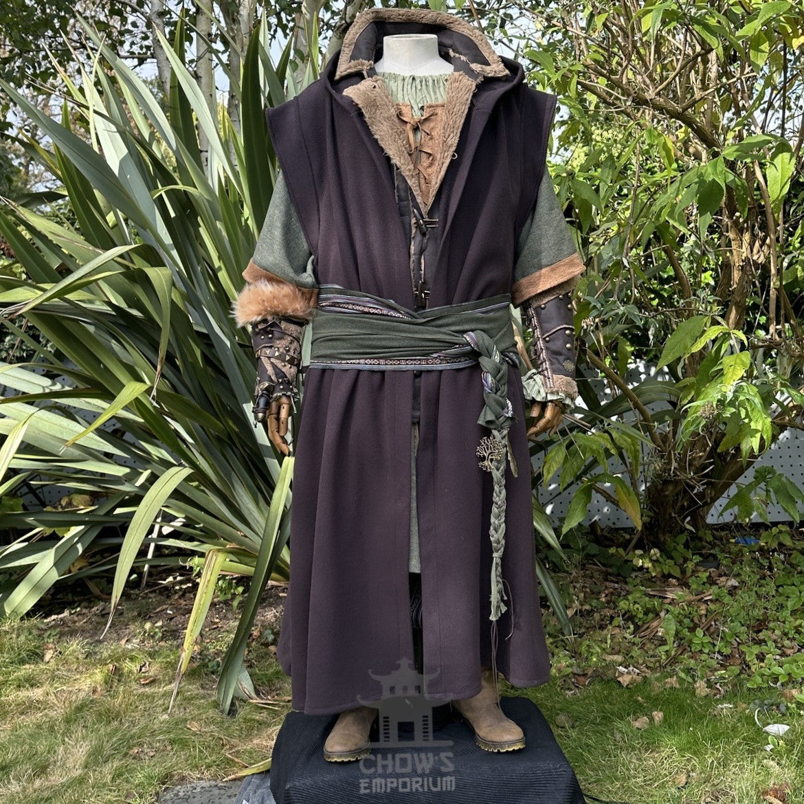 Medieval LARP costume with fur robe and braided sash, front view.