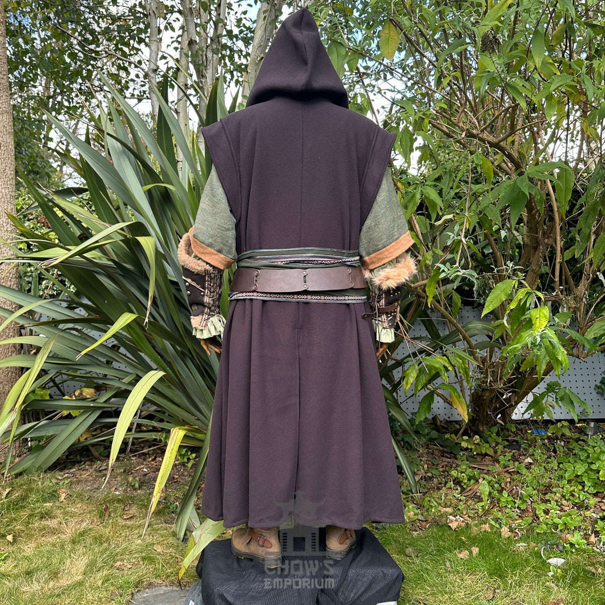 Back view of LARP costume with hooded robe, fur cuffs, and layered greenery.