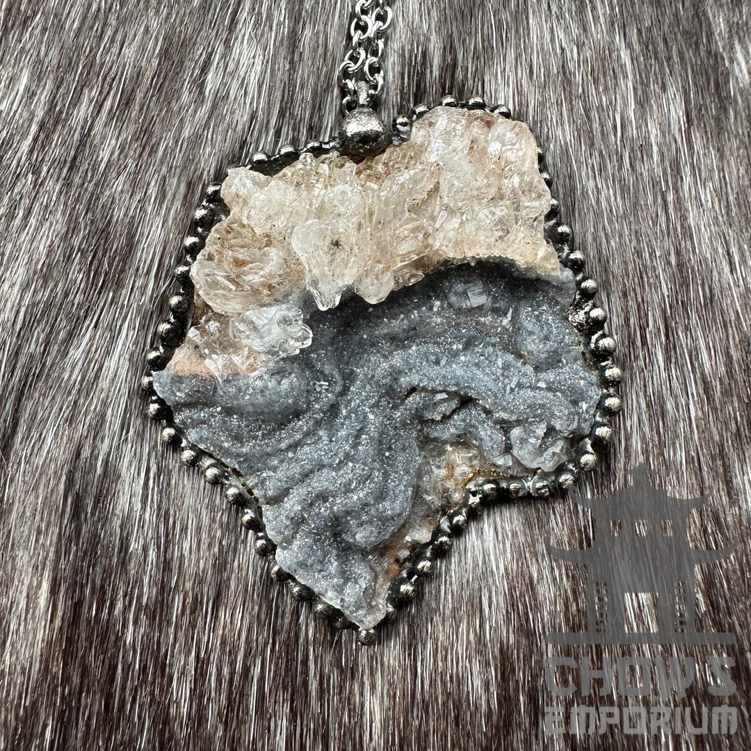 Crystal quartz necklace with white and grey stones on medieval chain.