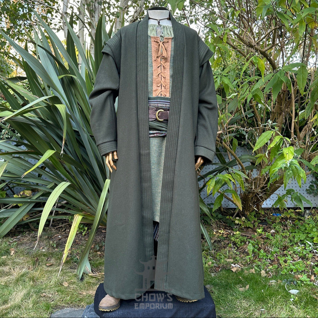 Mannequin in green medieval robe with belt.