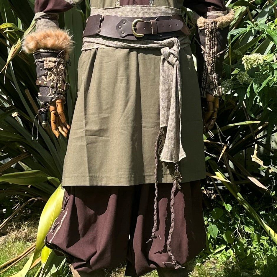 Medieval LARP ranger outfit close-up; sash, belt, fur vambraces.