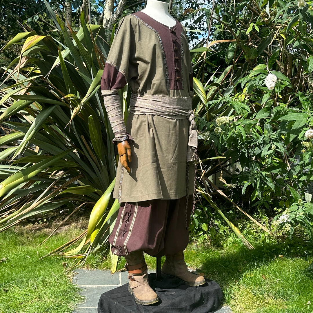 Medieval LARP outfit with tunic and sash, side view.
