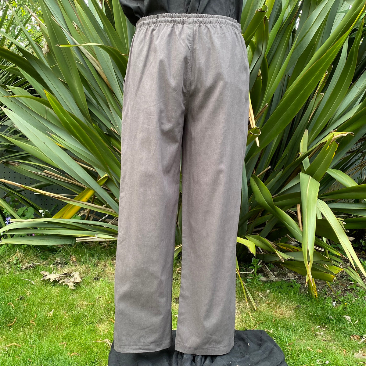 Back view of grey medieval trousers showing relaxed straight-leg cut for cosplay or Ren Faire no.