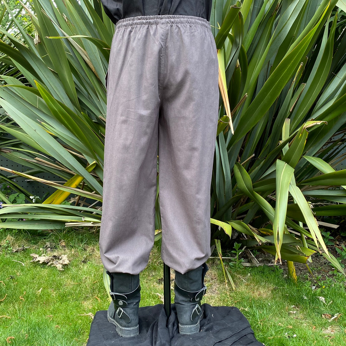 Back view of grey medieval trousers showing relaxed straight-leg cut for cosplay or Ren Faire.