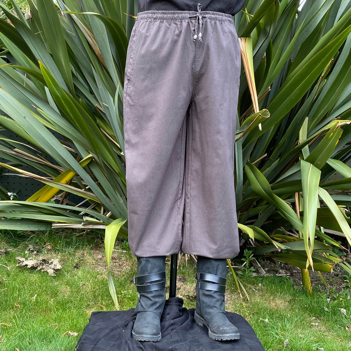 Front view of grey cotton straight-leg medieval trousers with adjustable waist for LARP wear.