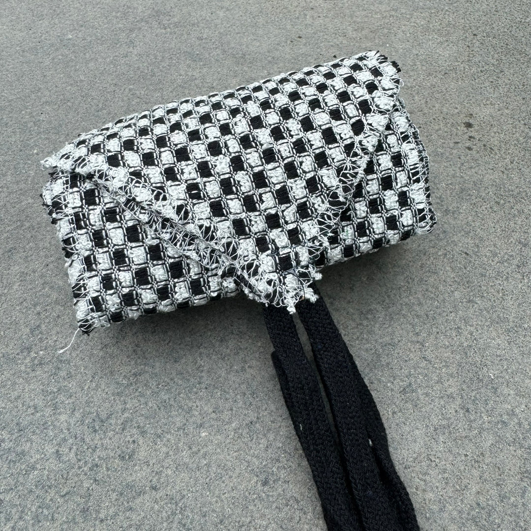 Black and white checkered wool leg wraps for LARP.