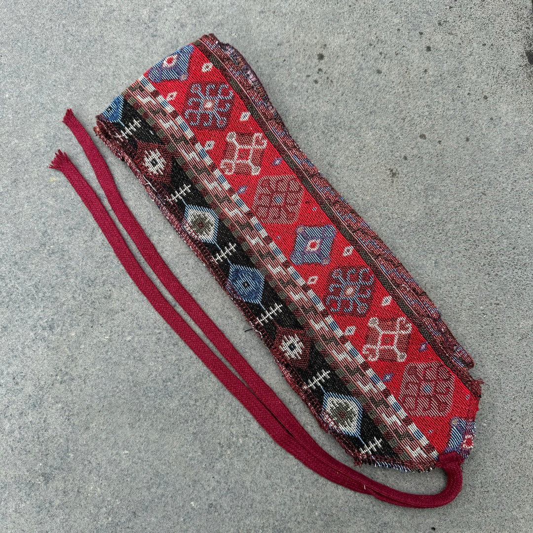 LARP medieval Aztec cotton leg wraps, red with geometric patterns, top view.
