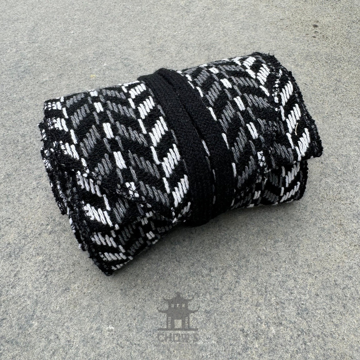 Black and white herringbone sash, folded for LARP.