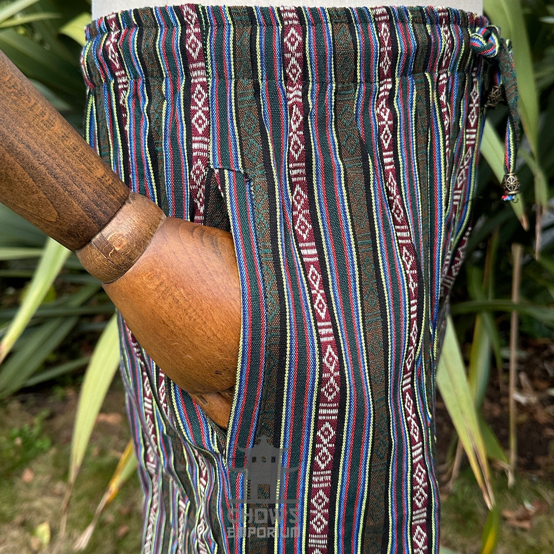 Close-up detail of pocket on green multi cotton medieval LARP trousers.