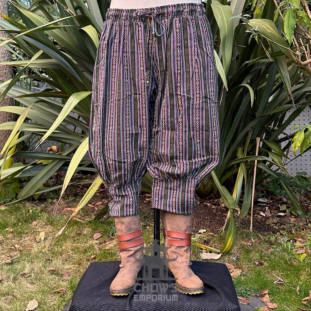 Front view of green multi cotton Viking pants with elasticated waist and ankles for LARP or cosplay.