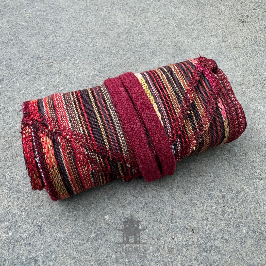 Autumnal stripe pirate sash, folded view, red and black.