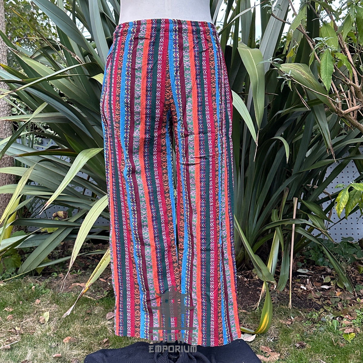 Back view of striped cotton LARP pants showing relaxed fit and elastic waistband no boots.