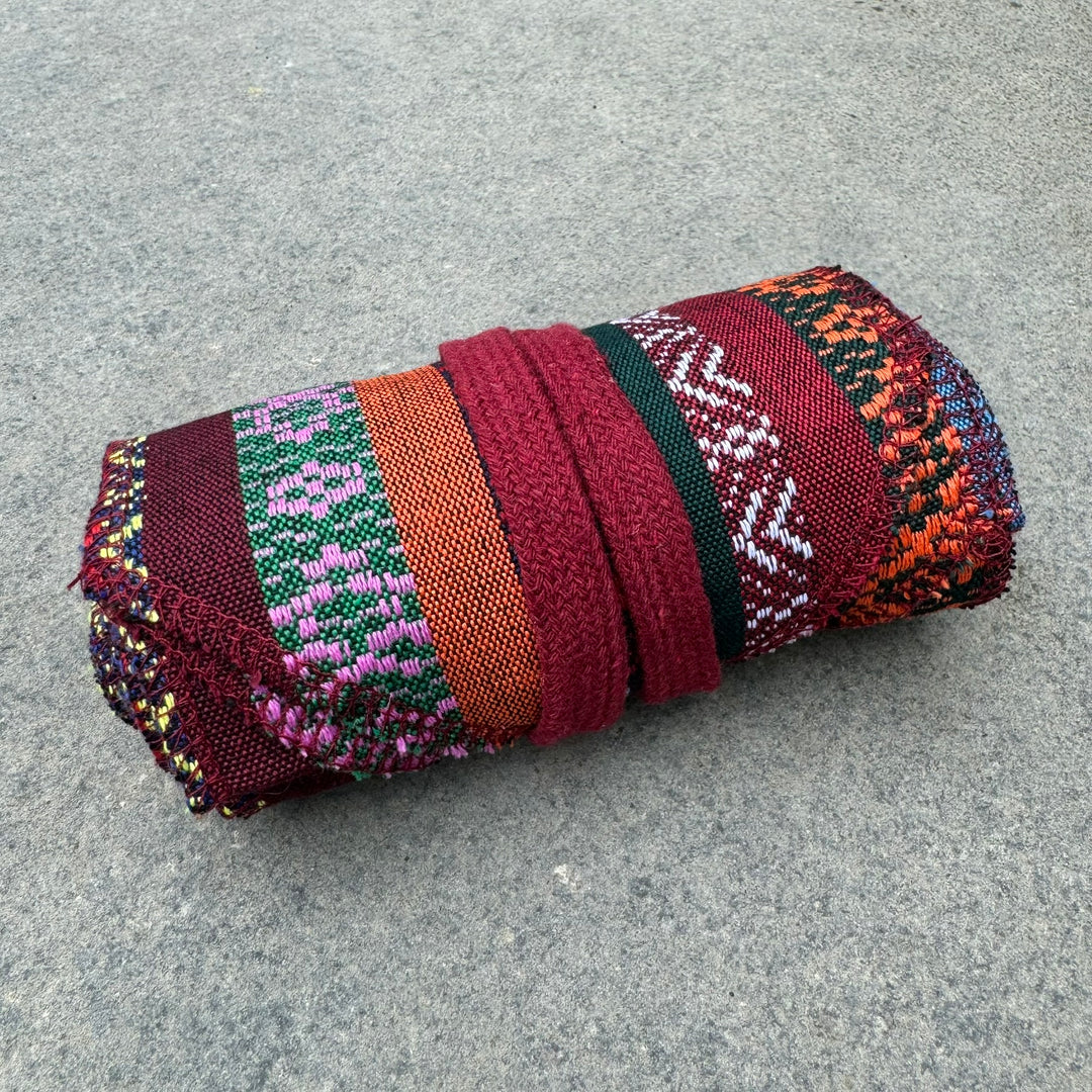 Multi pattern cotton leg wraps with red tones for medieval LARP attire.