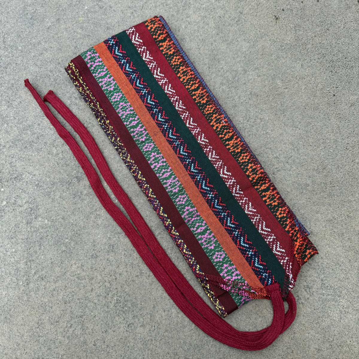 Multi-patterned cotton leg wraps for LARP, colorful stripes, side view.