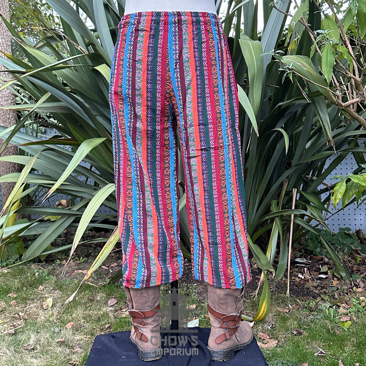 Back view of striped cotton LARP pants showing relaxed fit and elastic waistband.