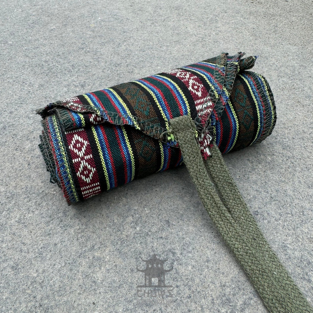 LARP belt and sash set, green stripe pattern, buffalo leather, rolled up.