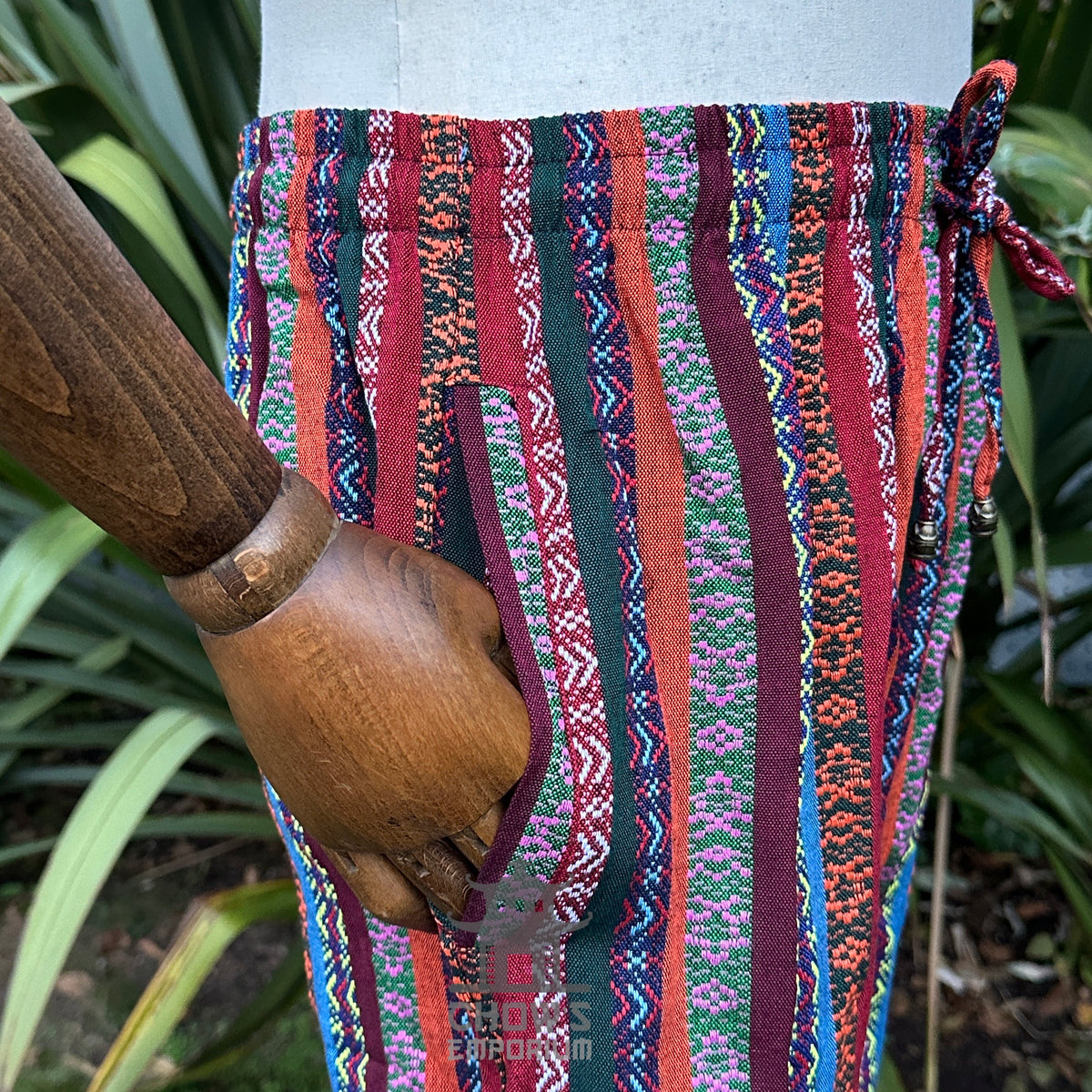 Detail of striped cotton-linen fabric pattern and pocket construction.