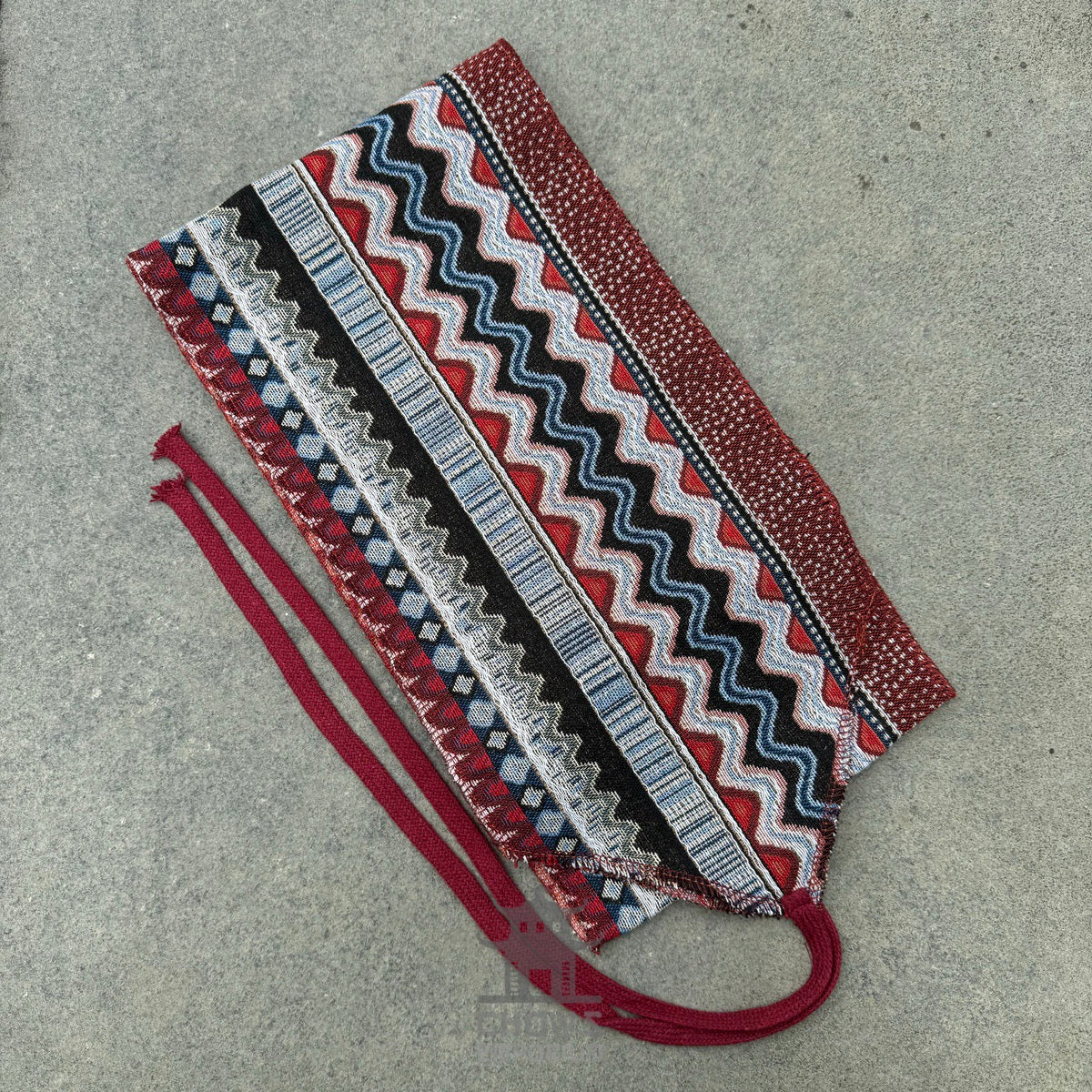 Woven sash with multicolored geometric stripes for LARP costume.