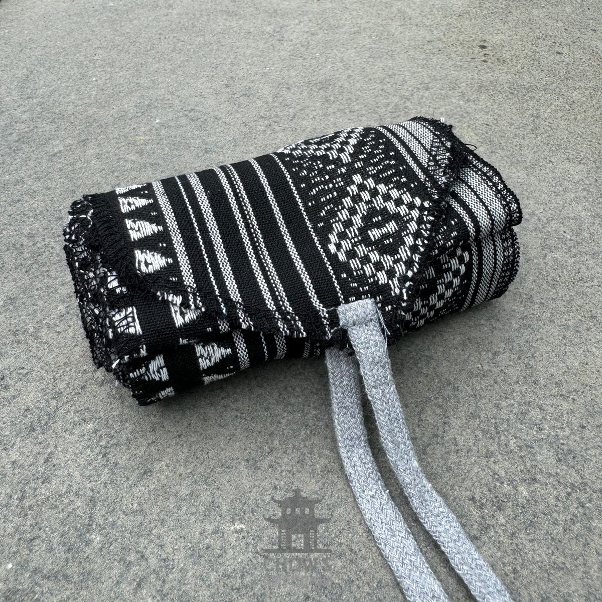 Black and white patterned cotton leg wraps with ties for LARP or medieval wear.