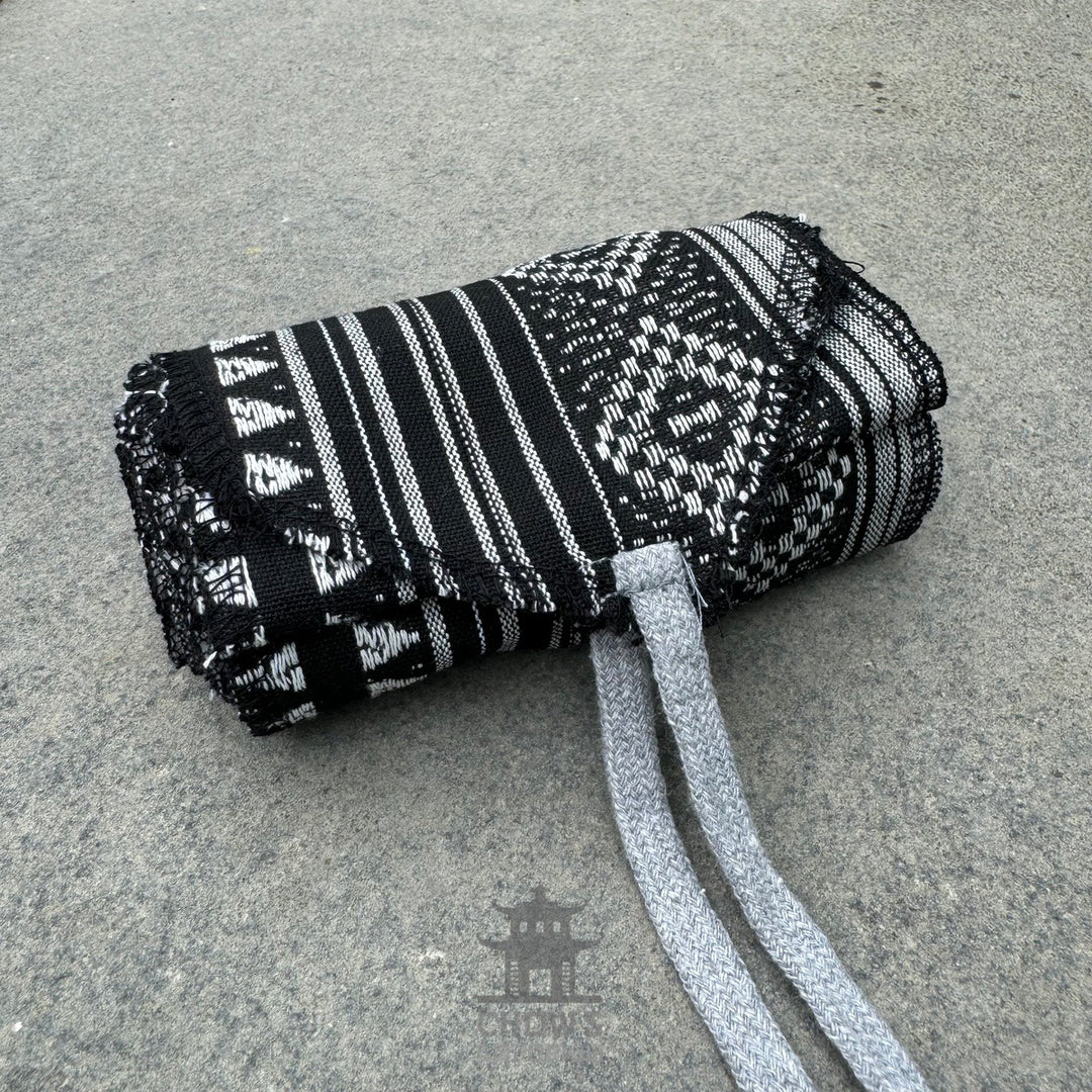 Black and white patterned cotton leg wraps with ties for LARP or medieval wear.