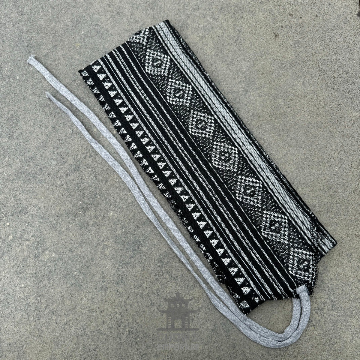 Black and white cotton leg wraps with patterns for LARP.