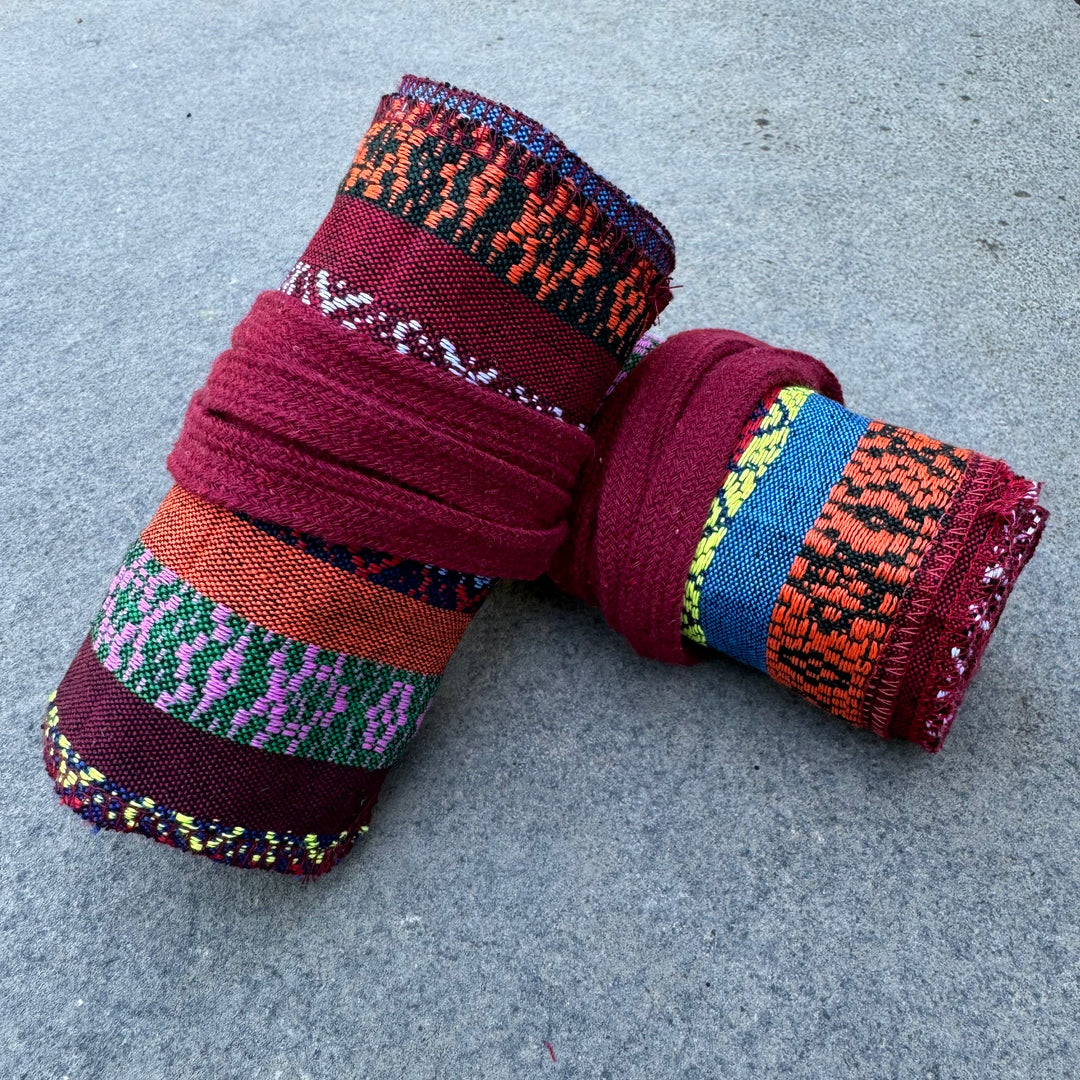 Multi-pattern cotton leg wraps for LARP in vibrant colors, rolled up.
