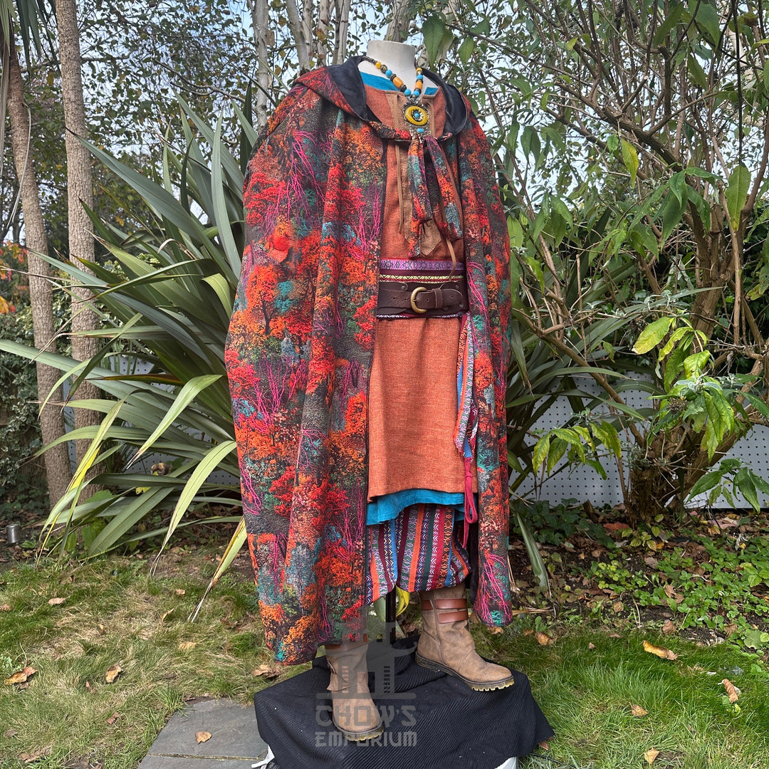 Angled front view of autumnal foliage LARP cloak, medieval fantasy cosplay costume for druids.