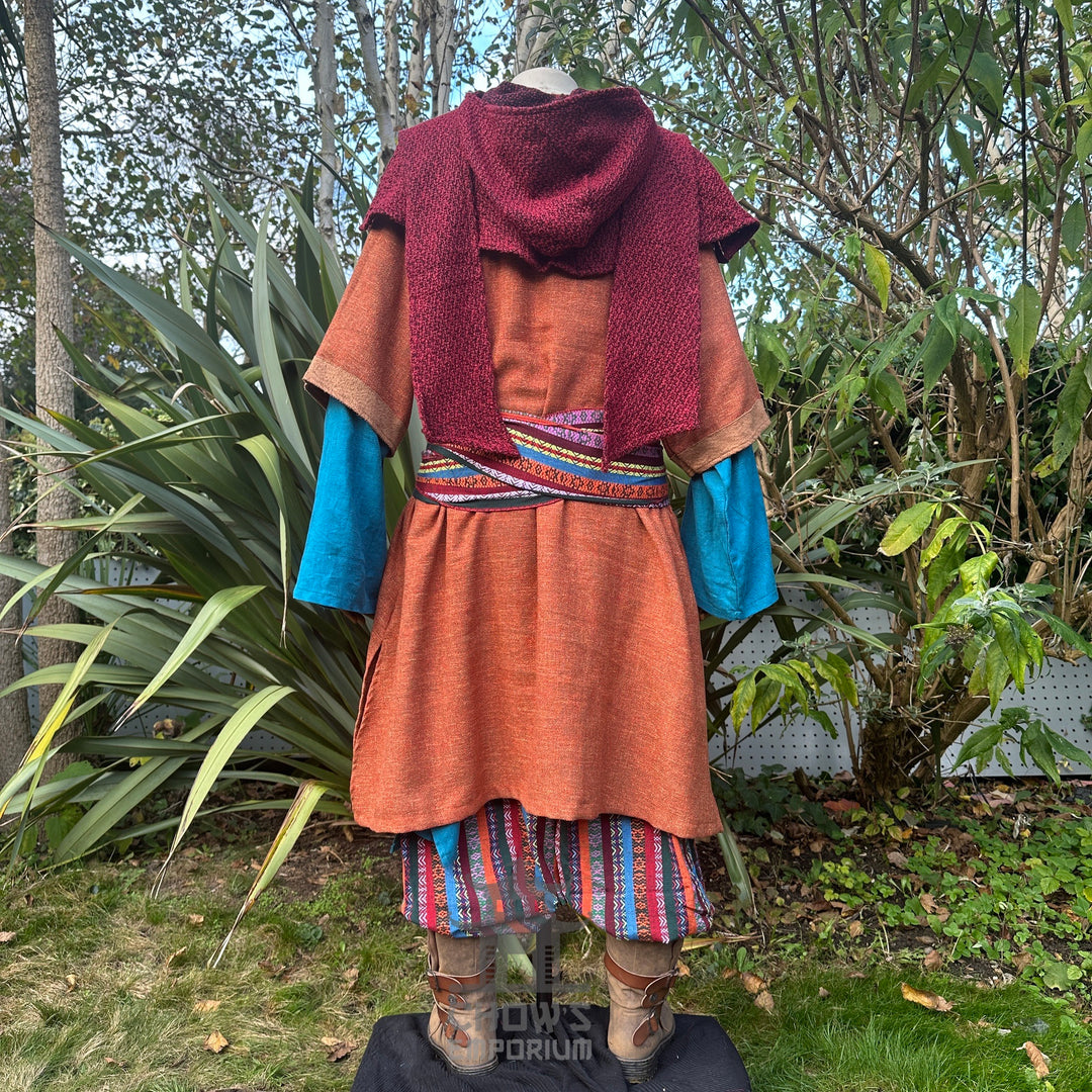 Orange and brown woven medieval tunic, back view.