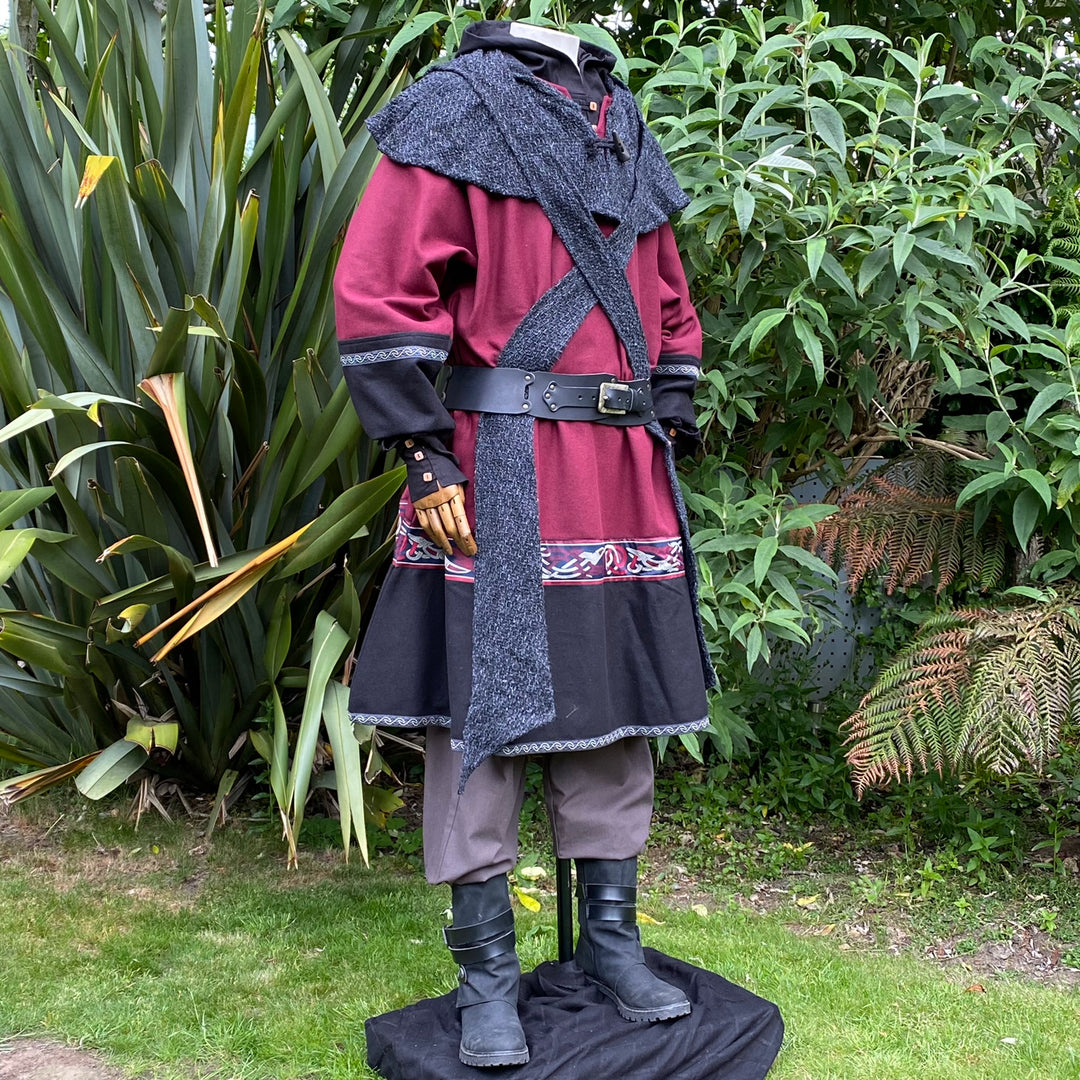 Mannequin in LARP outfit with red tunic, black boots, hooded cloak.