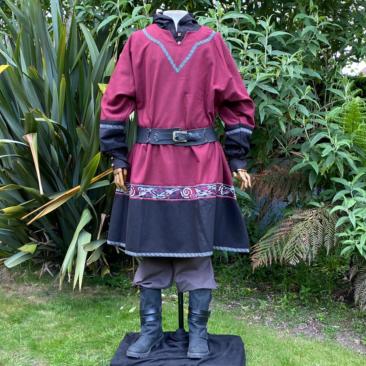 Medieval LARP attire with red tunic and belt.
