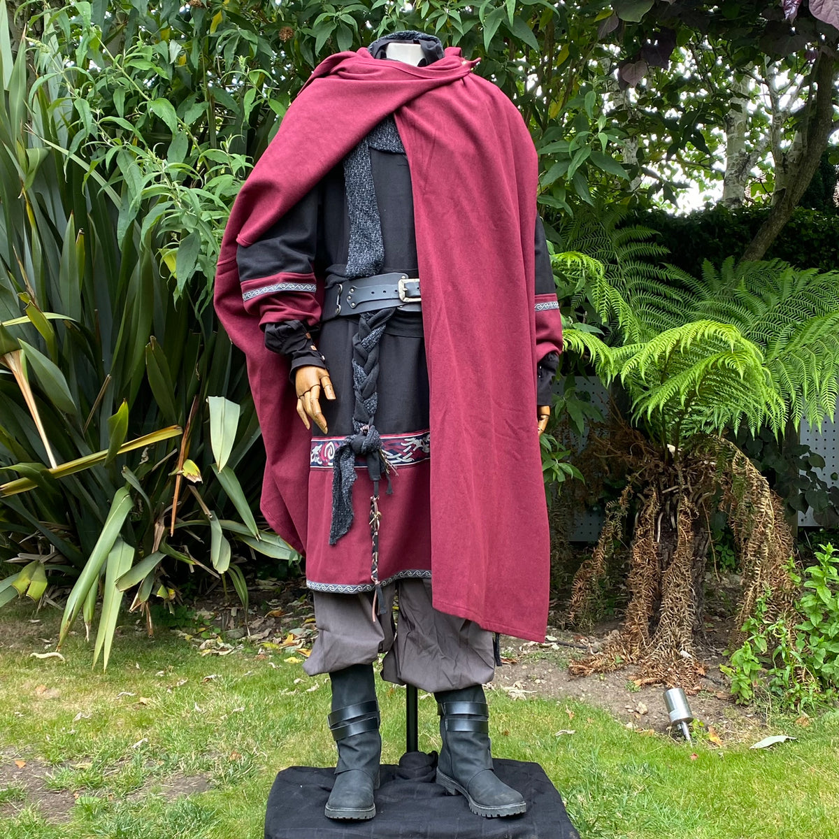 Mannequin in LARP attire, red cloak over black tunic.