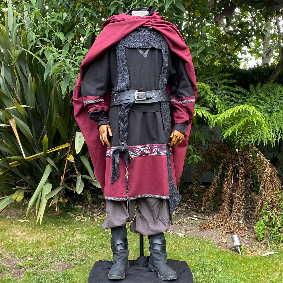 Mannequin in medieval LARP outfit with red cloak and detailed belt.
