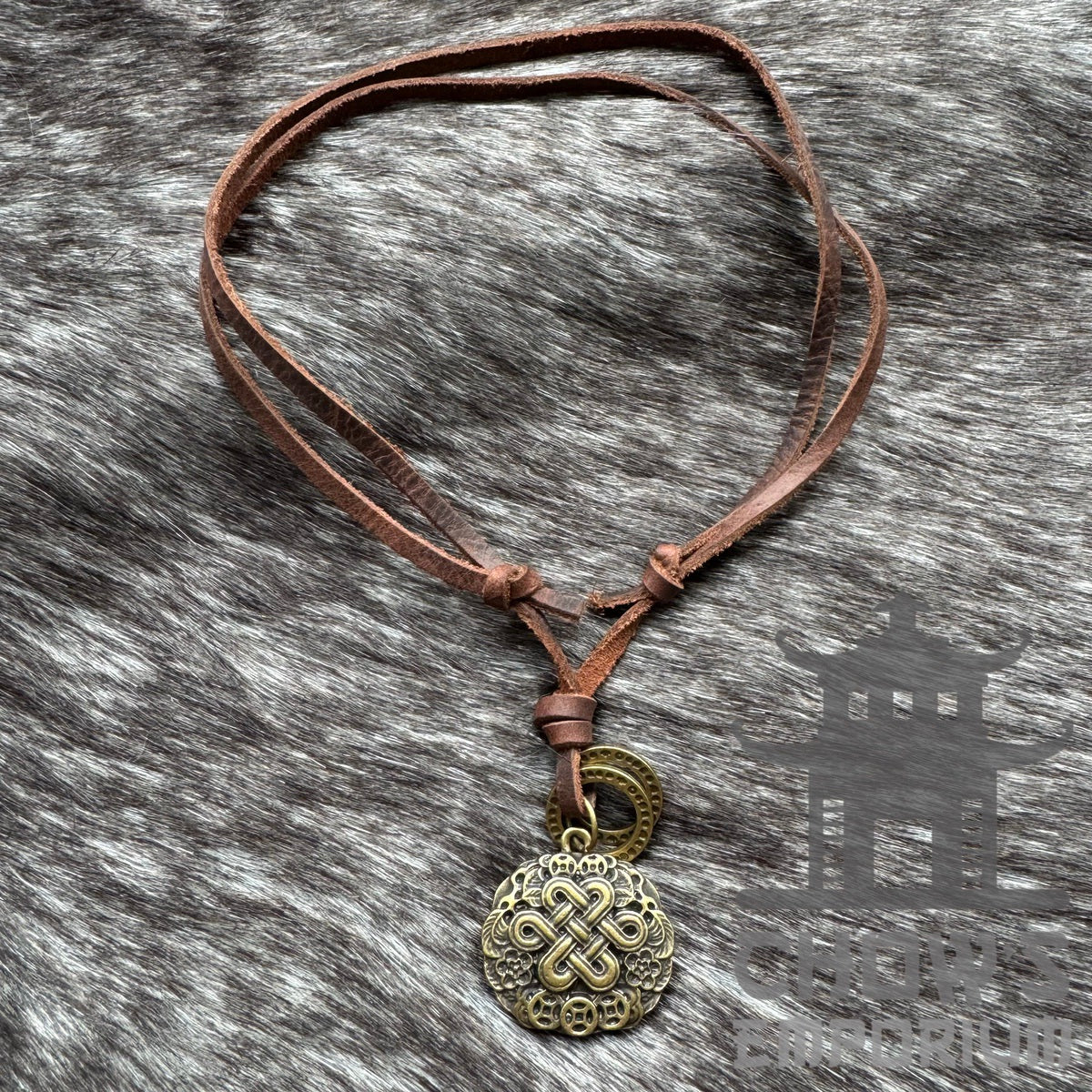 Celtic knot necklace with brass pendant on brown leather for LARP.
